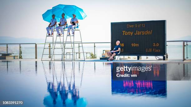 judges at a springboard diving competition - judge sports official stock pictures, royalty-free photos & images