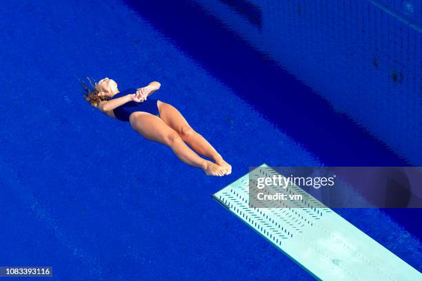 mid air - high diving platform stock pictures, royalty-free photos & images