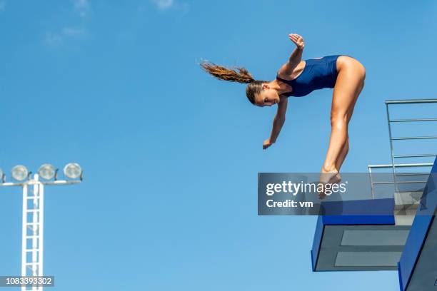 female springboard diver - high diving platform stock pictures, royalty-free photos & images