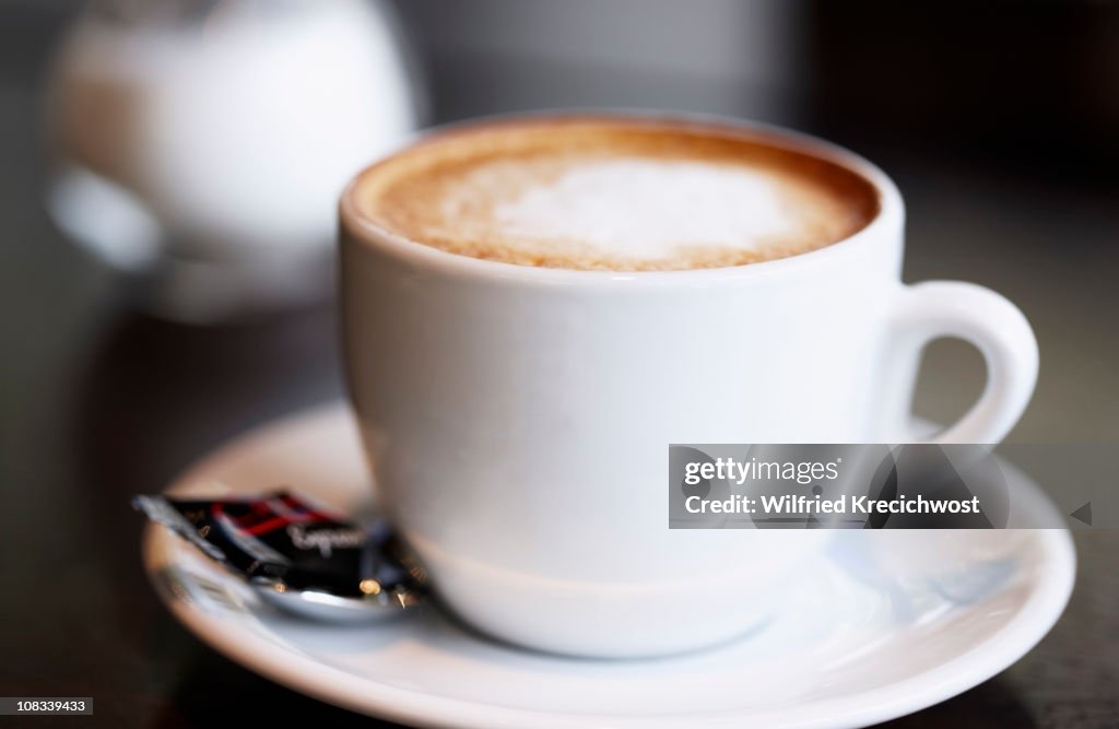 Cup of coffee latte on table, close-up