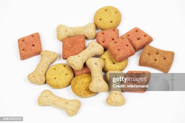 cookies for dog with different shape and colors - dog bone biscuit stock pictures, royalty-free photos & images