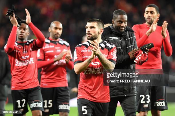 Guingamp's players celebrate after their 2-1 victory in the French L1 football match between Guingamp and Rennes on January 16 at the Roudourou...