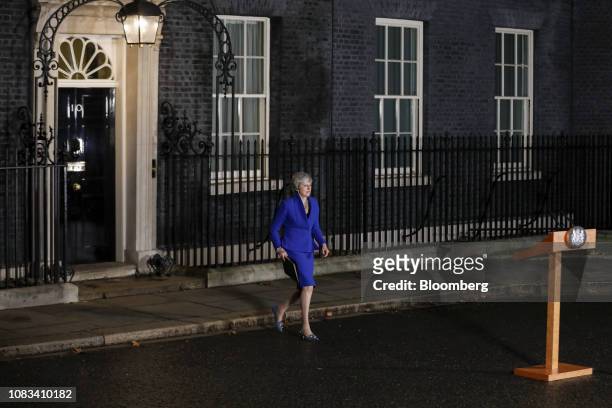 Theresa May, U.K. Prime minister, walks out to deliver a speech, after winning a confidence vote in Parliament, outside number 10 Downing Street in...