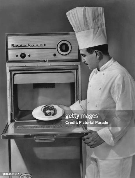 Chef using a Raytheon Radarange III, an early commercial microwave oven, circa 1958.