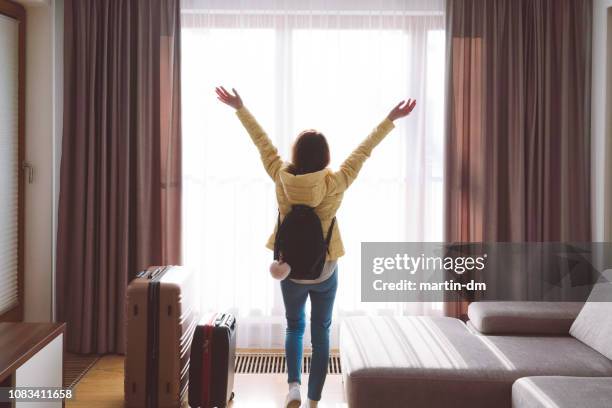 tourist woman enjoying luxury hotel room - drapeado stock pictures, royalty-free photos & images