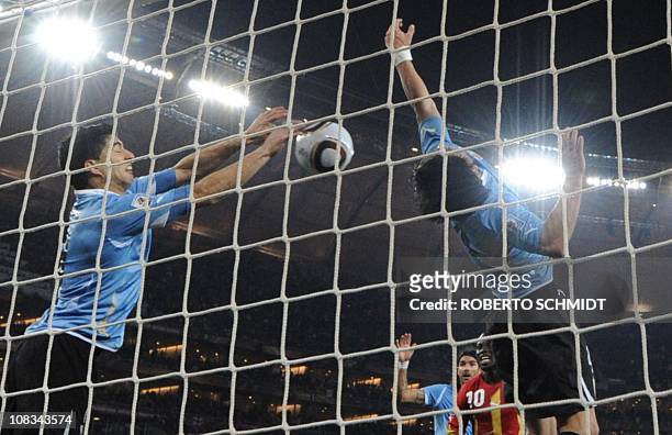 Uruguay's striker Luis Suarez stops the ball with the hand leading to a red card and a penalty for Ghana during the extra-time of 2010 World Cup...