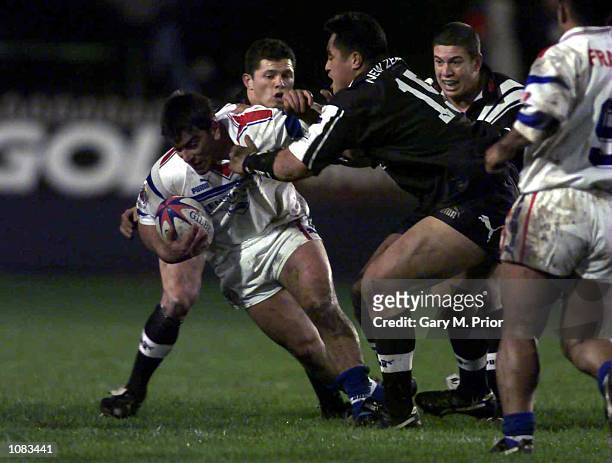 Jerome Guisset of France is tackled by Joe Vagana of New Zealand during the Rugby League World Cup Quarter Final match between New Zealand and France...