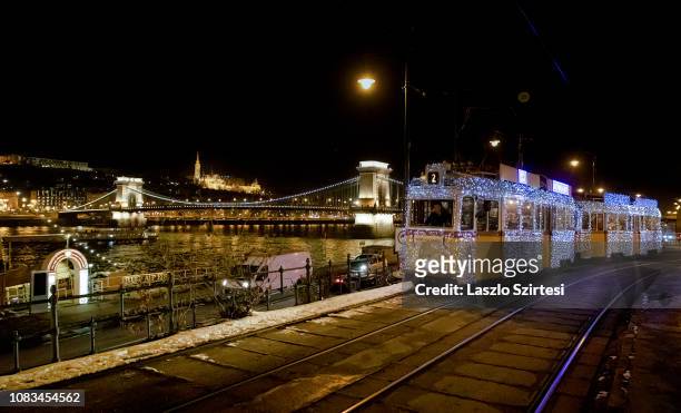 The 'Light tram' operates along the riverside of the Danube at the Eötvös tér on December 16, 2018 in Budapest, Hungary. Light trams are use to...