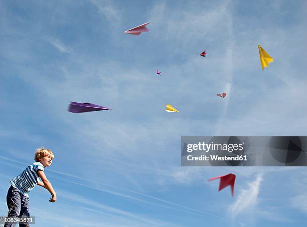 germany, bavaria, boy (4-5 years) playing with paper planes - paper plane ストックフォトと画像