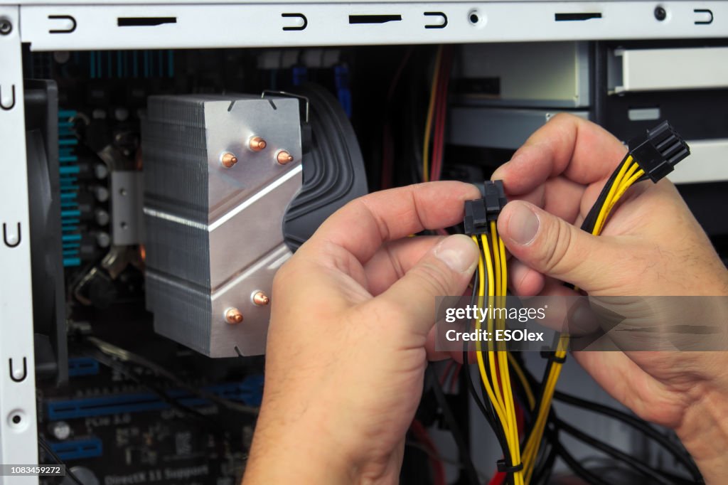 Computer Technician Assembles A Computer. Build A Home Pc
