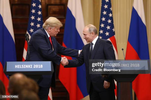 President Donald Trump, left, shakes hands with Vladimir Putin, Russia's President, during a news conference in Helsinki, Finland, on Monday, July...