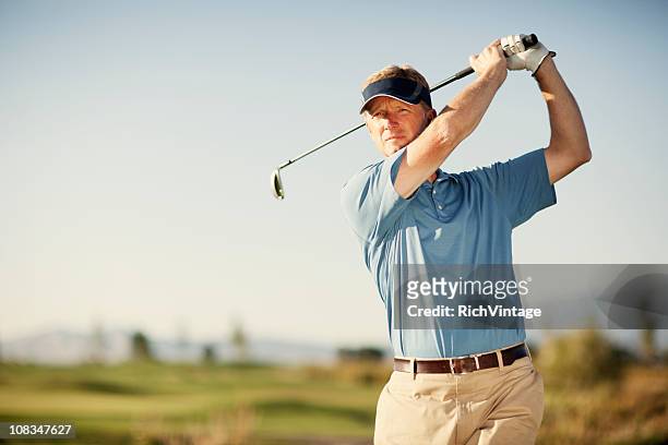 golf swing - using a swing stockfoto's en -beelden