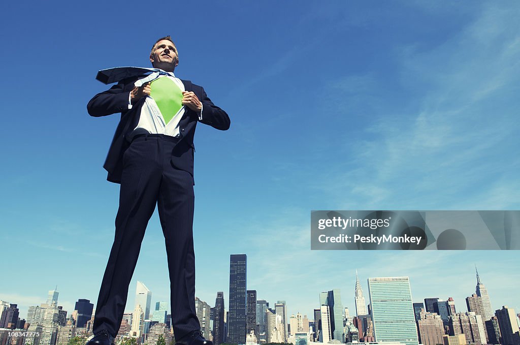 Superhero Businessman Smiling Standing above City Skyline