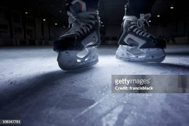 hockey skates on ice - ice hockey stock pictures, royalty-free photos & images