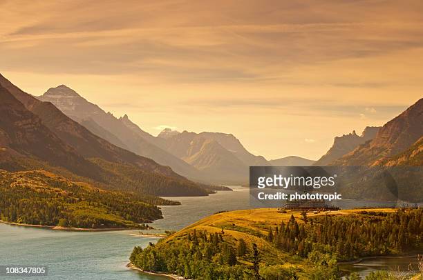 sunrise over upper waterton lake - glacier national park montana stock pictures, royalty-free photos & images