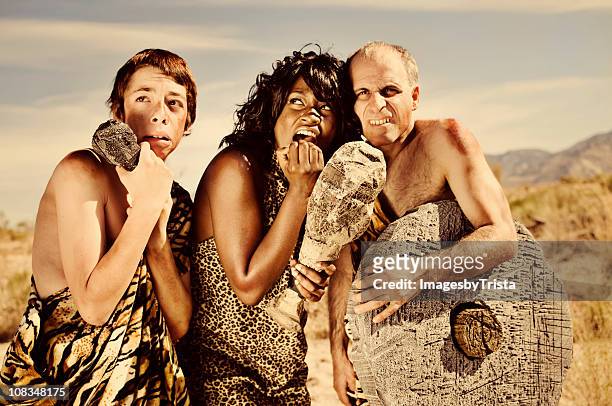 scared prehistoric cavemen - men in loincloths stock pictures, royalty-free photos & images