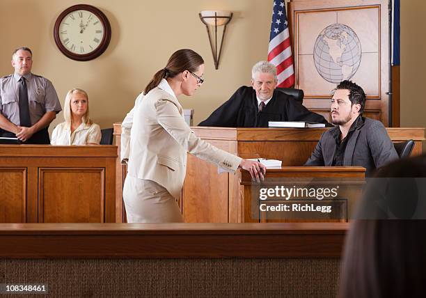 lawyer in a courtroom - courtroom stock pictures, royalty-free photos & images