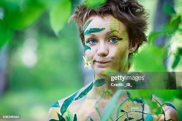 portrait of a young beautiful playful nymphs with flower - forest nymph stock pictures, royalty-free photos & images