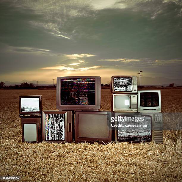 televisions in the darkness - retro television set stock pictures, royalty-free photos & images