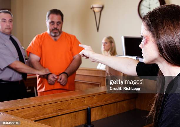 criminal and victim in court - handcuffed man standing in courtroom stock pictures, royalty-free photos & images