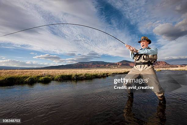 fish on! - funny hobbies stock pictures, royalty-free photos & images