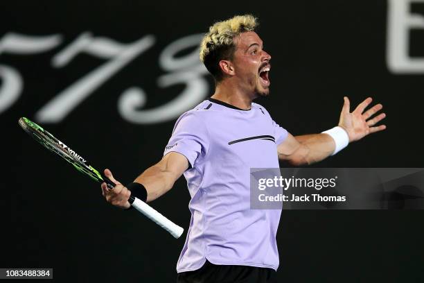 Alex Bolt of Australia celebrates winning match point in his second round match against Gilles Simon of France during day four of the 2019 Australian...