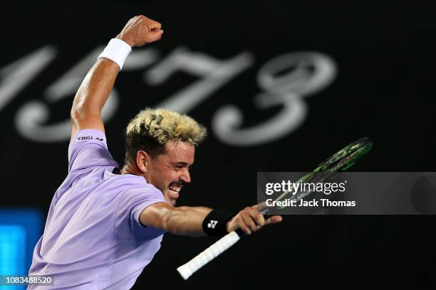 Alex Bolt of Australia celebrates winning match point in his second round match against Gilles Simon of France during day four of the 2019 Australian...