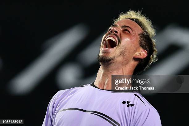 Alex Bolt of Australia celebrates winning match point in his second round match against Gilles Simon of France during day four of the 2019 Australian...