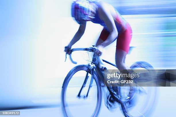 speeding cyclist - road race stock pictures, royalty-free photos & images