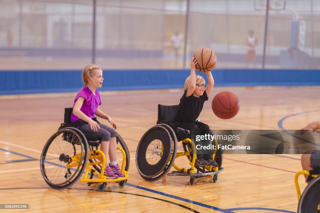 Basketball players using wheelchairs