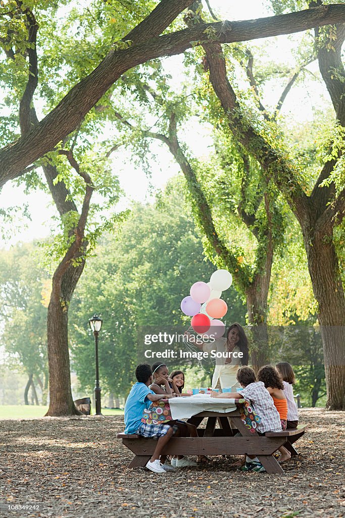 Outdoor birthday party with balloons