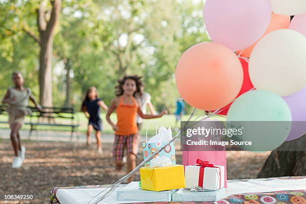 outdoor birthday party with balloons - picnic table park stock pictures, royalty-free photos & images