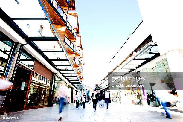 shoppers - shopping mall stock pictures, royalty-free photos & images