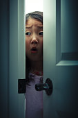 Peeking Fearfully behind a Door