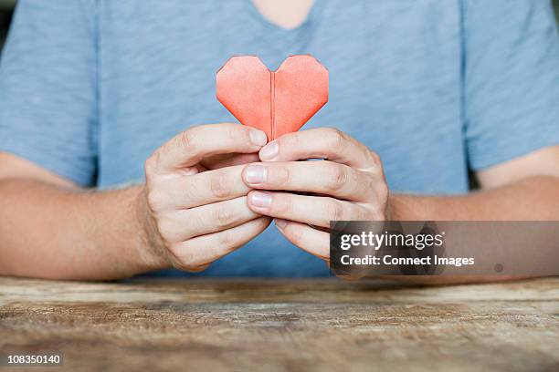 Person Holding Origami Heart High-Res Stock Photo