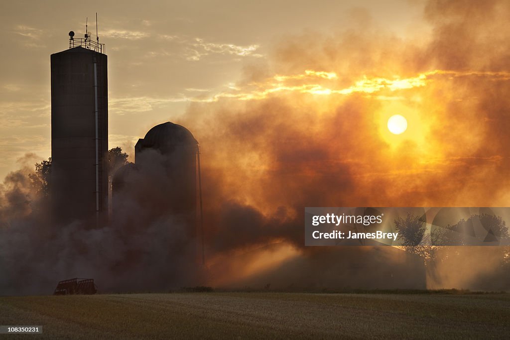 Barn Fire in the Light of Sunset