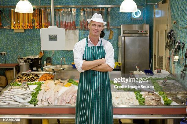 portrait of a fishmonger - fishmonger stock pictures, royalty-free photos & images