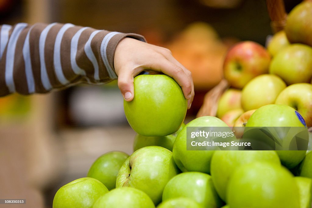 Child holding an apple