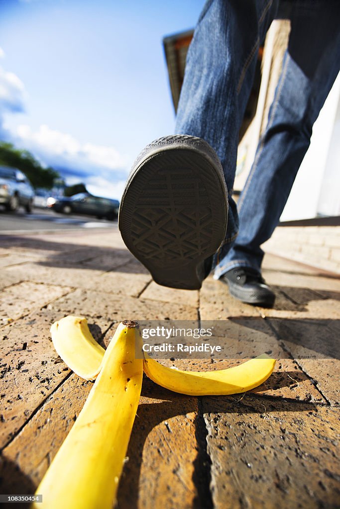 Comic accident classic about to happen: foot approaches banana peel