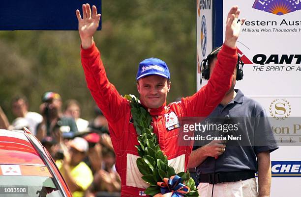 Tommi Makinen of Finland and the Marlboro Mitsubishi Ralliart team, celebrates victory on the final day of the Telstra Rally Australia which is part...
