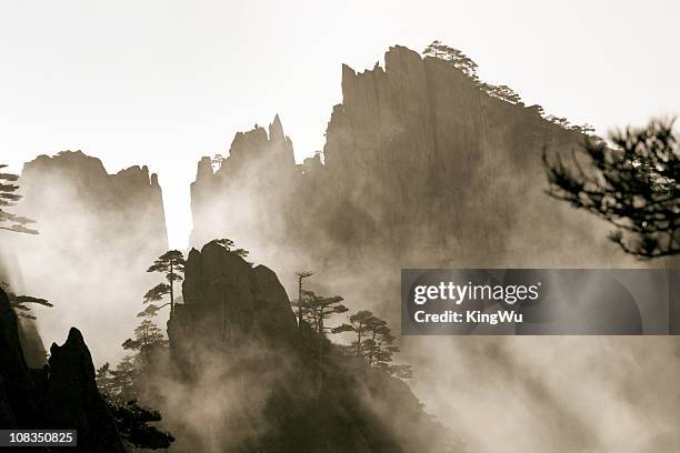 mountain in mist - lotus flower peak stock pictures, royalty-free photos & images