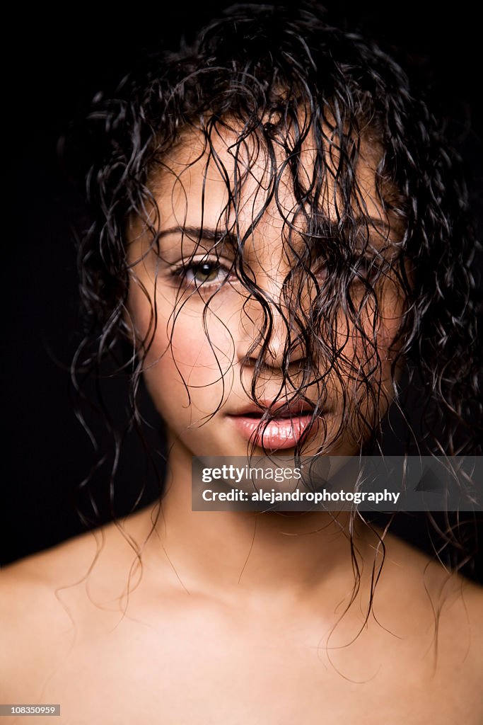 Mixed race woman with wet curly hair