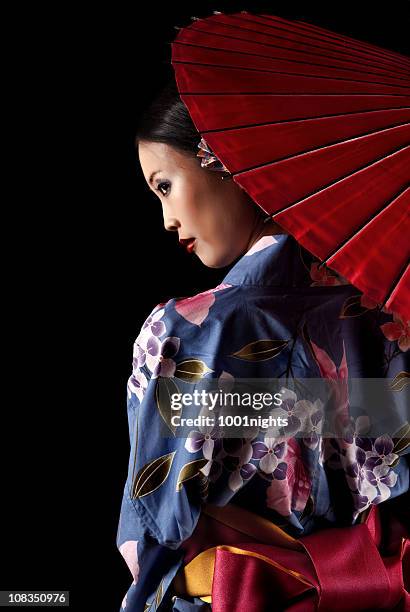 japanese geisha with a red umbrella - geisha japan stock pictures, royalty-free photos & images