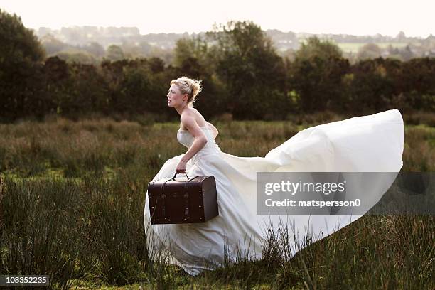 bride running away - bride running stock pictures, royalty-free photos & images