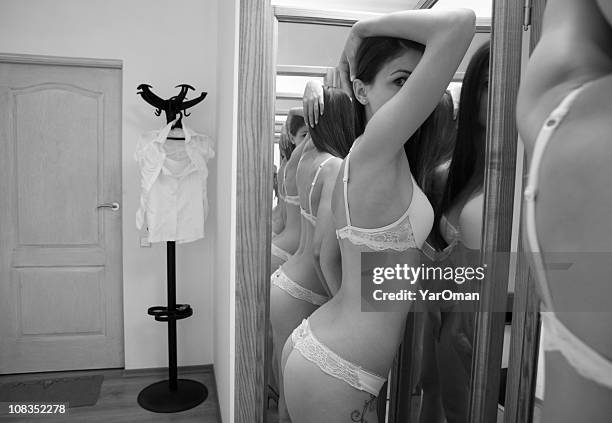 woman at the mirror - door hanger stock pictures, royalty-free photos & images