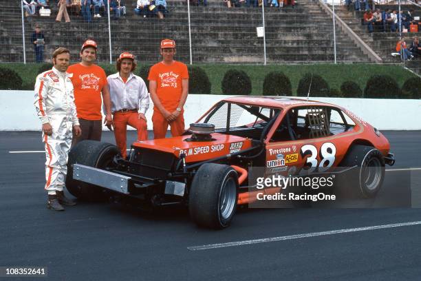 Jerry Cook and his crew pose with his Pinto-bodied car before a NASCAR Modified race at Martinsville Speedway. Cook would go on to win the 1975...