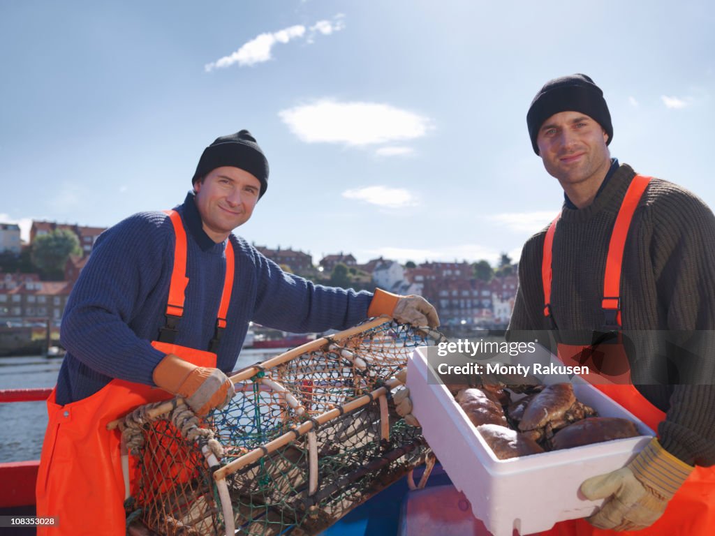 Fishermen with crabs and lobster pots