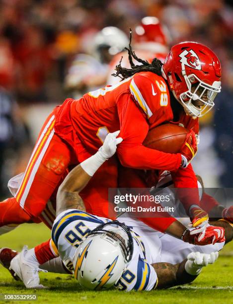 Defensive back Tremon Smith of the Kansas City Chiefs is tackled by linebacker Kyle Wilson of the Los Angeles Chargers on a kickoff return at...
