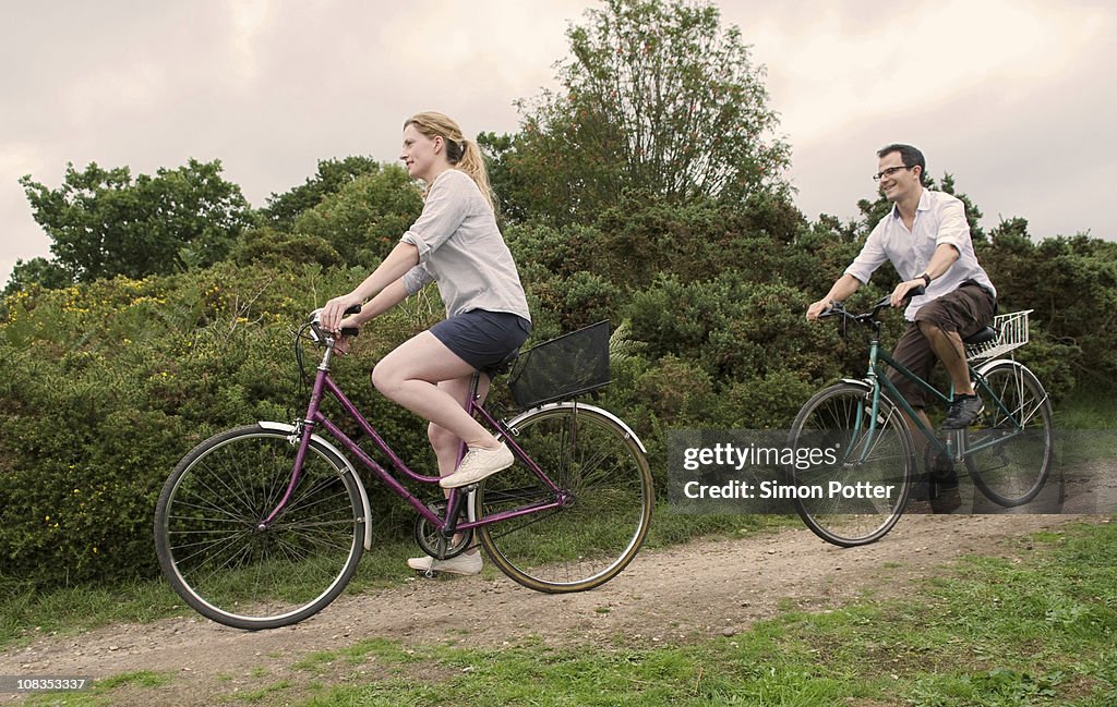 Couple bicycle over heath