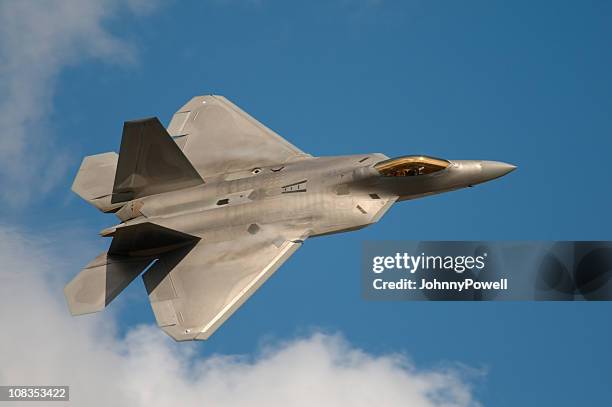 f22 raptor jet fighter flying in the sky - us air force stock pictures, royalty-free photos & images